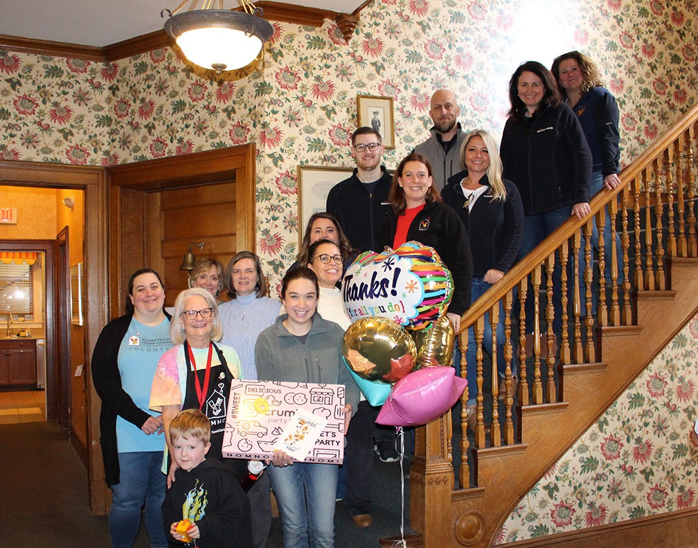 People standing on the stairs of the ronald mcdonald house